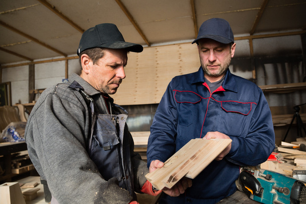 Inspector and carpenter in the carpentry workshop - Foto, Imagem