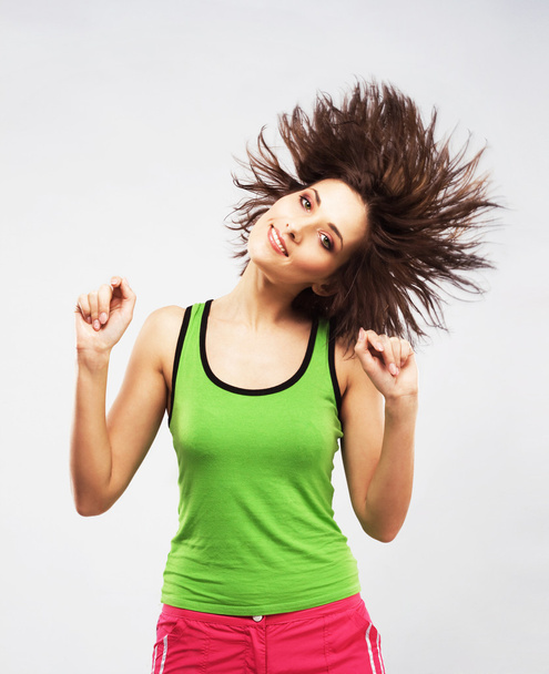 Lovely young woman having fun with shaking her hair - Fotó, kép