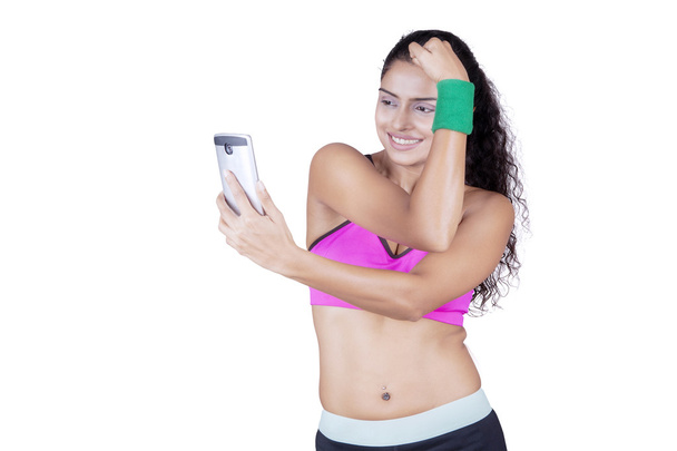 Fitness woman taking self portrait - Foto, Imagen