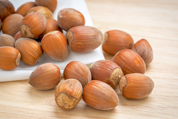 Hazelnuts, filbert on old wooden background - Photo, image
