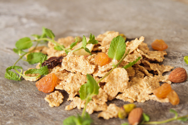 muesli with nuts and dried fruits mint leaves - Foto, imagen