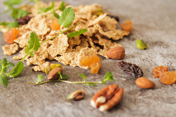 muesli with nuts and dried fruits mint leaves - Foto, Imagem