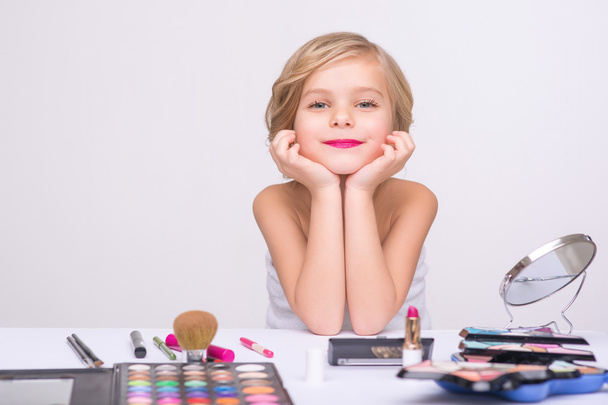 Nice little girl doing make up - Фото, зображення