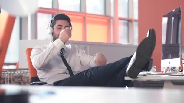 happy young startup business man listening music - Video