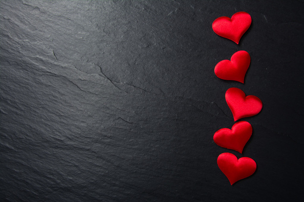 Red hearts on stone background - Photo, Image
