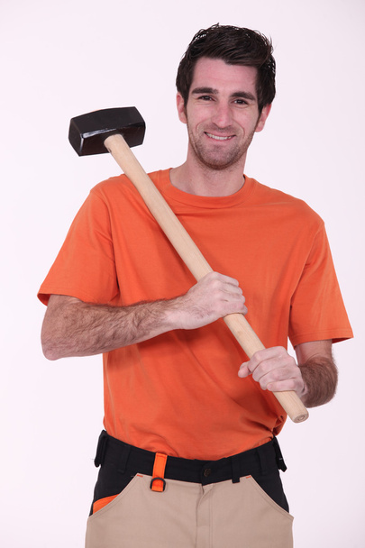 Craftsman holding a huge hammer - Photo, Image