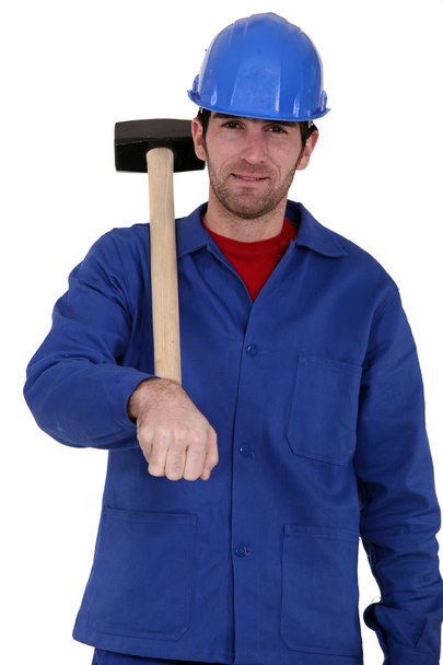 Craftsman holding a hammer - Фото, зображення