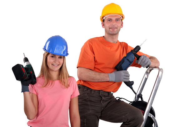Man and woman with drills - Foto, imagen