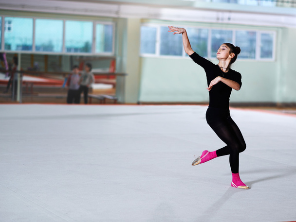 girl dancing on training  rhythmic gymnastics - Фото, изображение