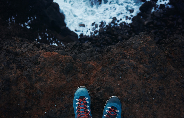  top view blue trekking shoes on the edge - Fotó, kép