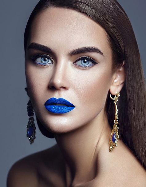 sensual glamour portrait of beautiful  woman model lady with colorful makeup with blue lips  and jewelry - Photo, Image