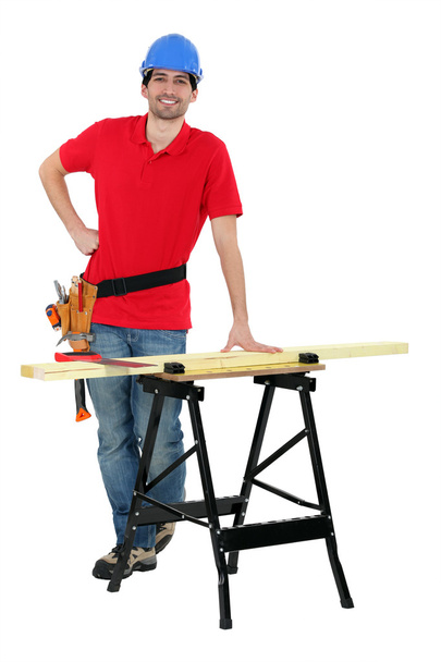 Carpenter cutting wood - Foto, Bild
