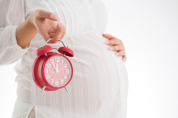 Contando le ore che aspettano il parto. Concetto di maternità. Pregna
 - Foto, immagini