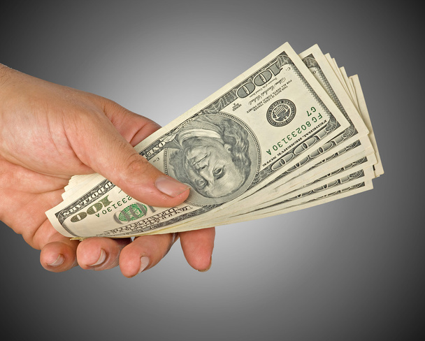 Hand with dollar bills isolated on background - Photo, Image