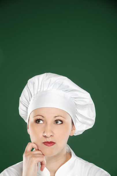 jonge vrouwelijke chef-kok denken - Foto, afbeelding