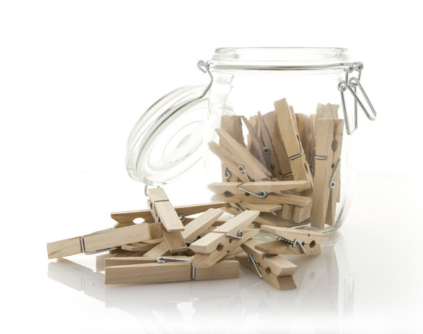 Wooden clothes pegs in a glass Jar - Photo, Image