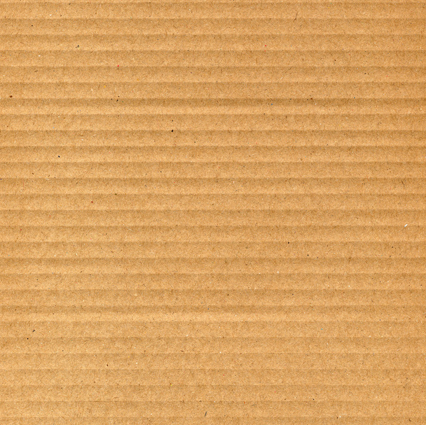 Cartón ondulado marrón útil como fondo - Foto, Imagen