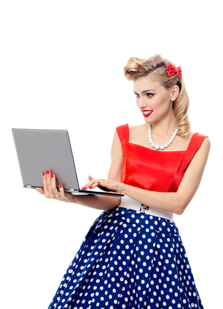 woman holding laptop, dressed in pin-up style dress - Foto, Imagen