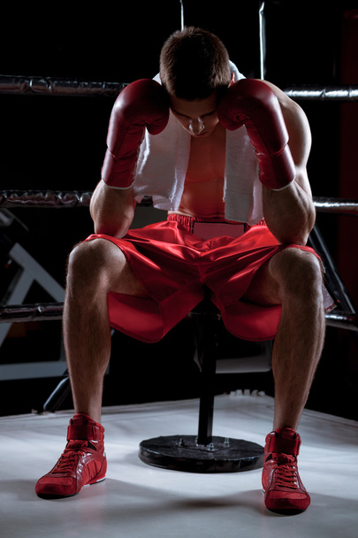 Professional young boxer is expressing negative emotions - Foto, afbeelding