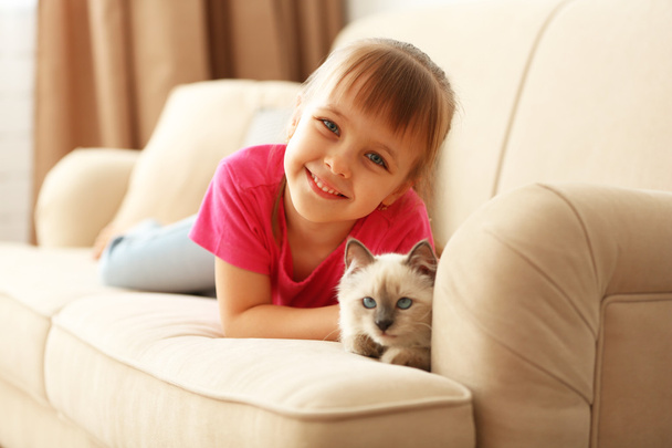 Little cute girl with kitten - Photo, Image