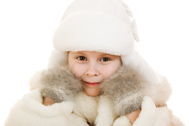 The girl in warm clothes smiling on white background. - Valokuva, kuva