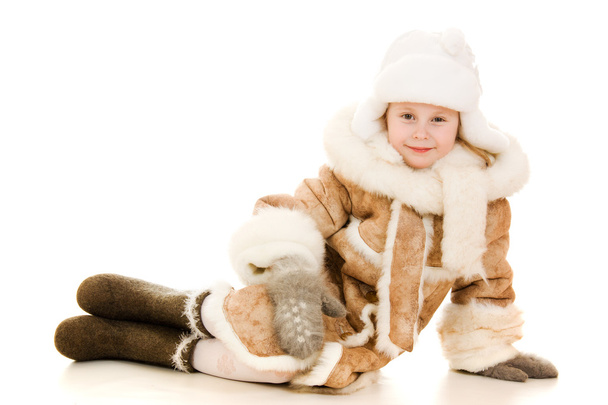 The girl in warm clothes smiling on white background. - Foto, imagen