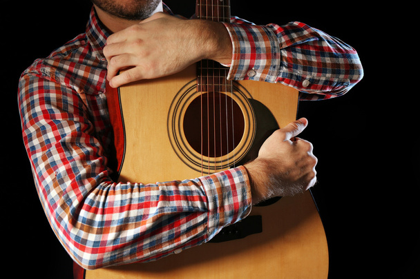Young man with guitar  - Zdjęcie, obraz