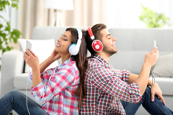 Teenager couple listening to music - Photo, image