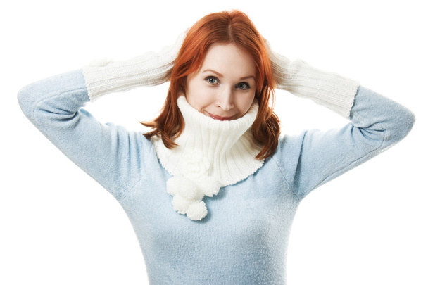 Beautiful girl in a scarf and mittens on a white background. - Foto, Imagen