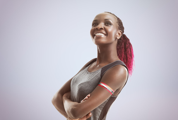 Modern sportswoman wearing digital watche - Фото, изображение