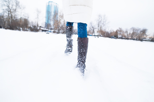 Girl running in the snow, late - 写真・画像