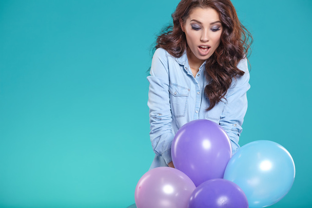 brunette woman with balloons - 写真・画像