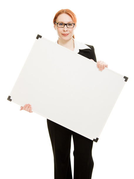 Businesswoman holding blank whiteboard sign. - Foto, afbeelding