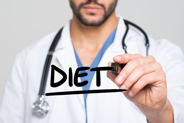 Doctor writing the word Diet - Foto, Imagen