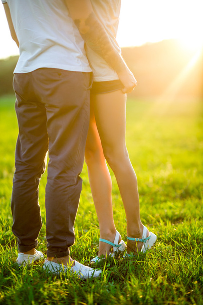 Beautiful young loving couple hugging in nature - Photo, Image