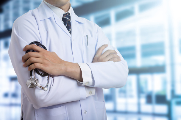 Doctor holding stethoscope with medical uniform in hospital  - Photo, Image