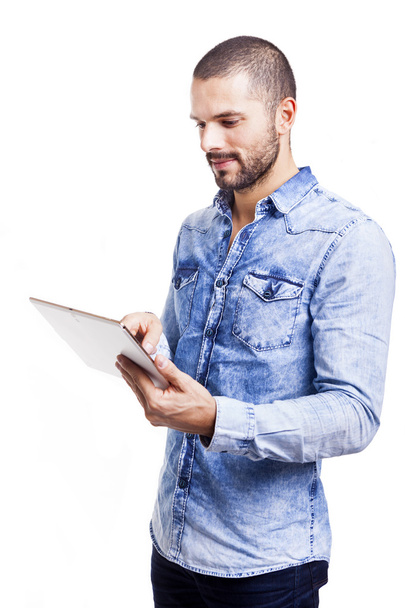 Casual man using a tablet computer - Foto, afbeelding