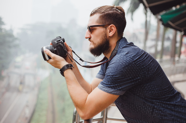happy young guy with big camera - Foto, Imagem
