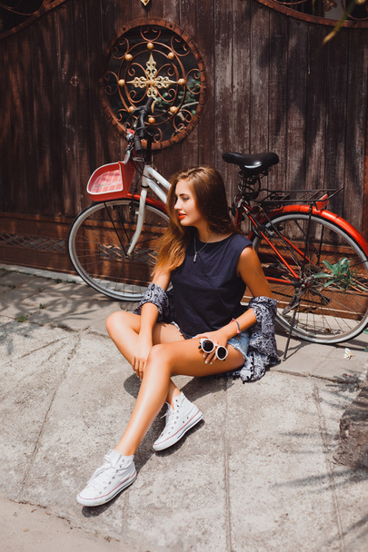 hipster girl near  bike - Фото, изображение