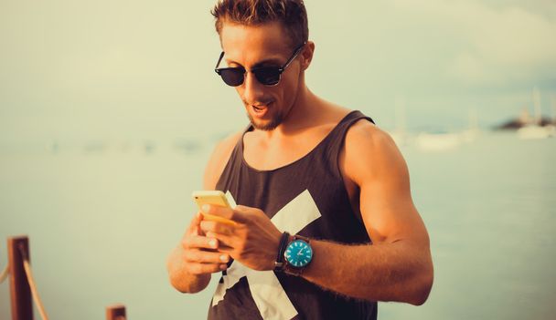 young guy  talking on the smartphone - Photo, Image