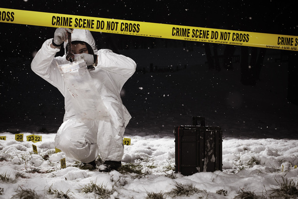 Snowing on evidences of murder - Фото, изображение