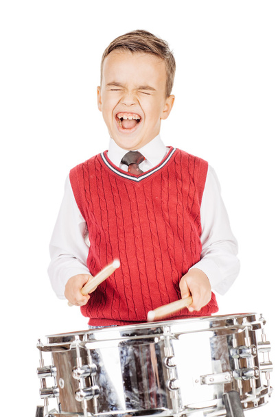 Portrait Boy young boy drumming on white background.  - Photo, image