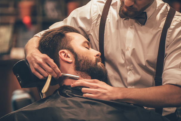 young handsome man in barbershop - Valokuva, kuva