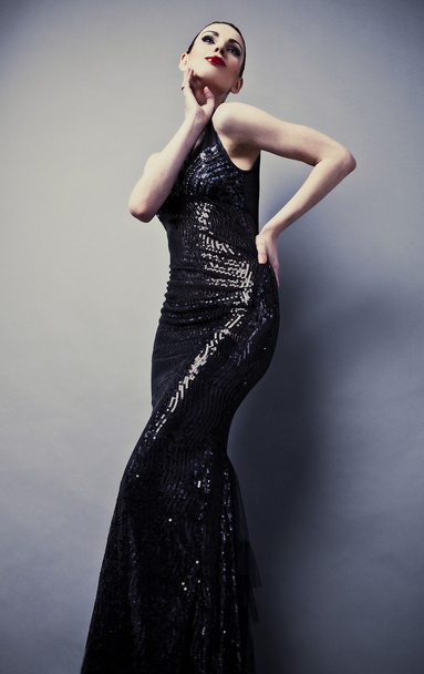 Beautiful woman on black classical dress pose in studio. - Foto, Imagem