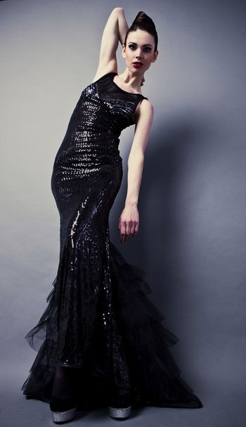 Beautiful woman on black classical dress pose in studio. - Фото, зображення