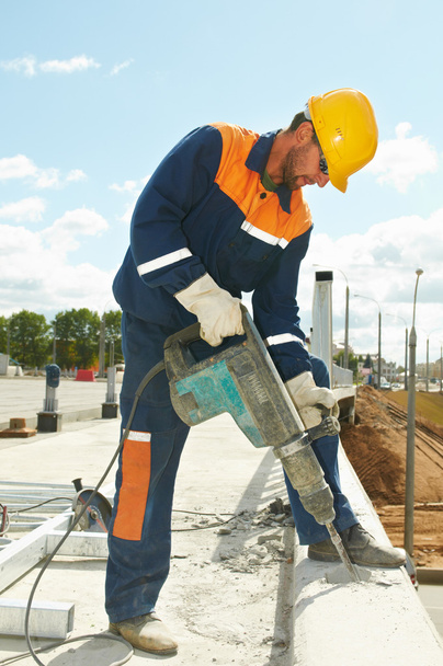 Portrait of construction worker with perforator - Fotó, kép
