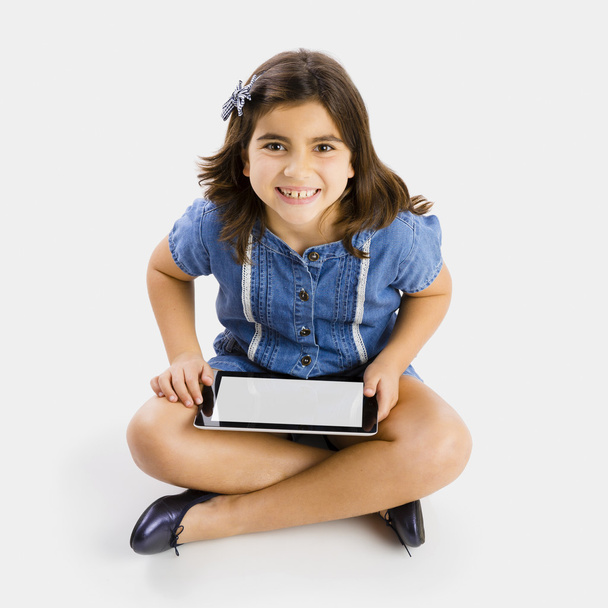 Young girl using a tablet - Zdjęcie, obraz