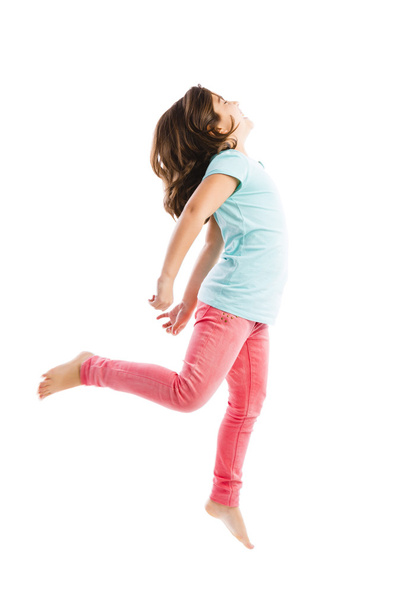 Щаслива молода дівчина стрибає
 - Фото, зображення