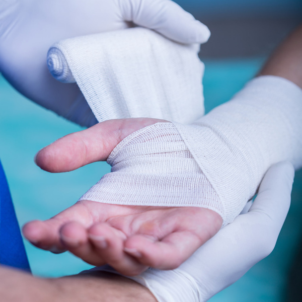 Strapping patient's arm - Photo, image