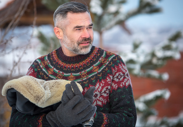 Elegant  handsome man wearing sweater, outdoors winter portrait - Фото, зображення